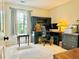 Well-lit office with built-in desk, ample storage, and a view of the outdoors at 9030 Brockham Way, Johns Creek, GA 30022