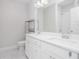 Bright bathroom with double sinks, white cabinetry, and modern fixtures at 2026 Manchester Ne St, Atlanta, GA 30324