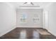 Neutral bedroom featuring a ceiling fan, tray ceiling, and great natural lighting at 2026 Manchester Ne St, Atlanta, GA 30324