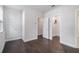 Guest bedroom featuring hardwood floors, a walk-in closet, and ensuite bathroom access at 2026 Manchester Ne St, Atlanta, GA 30324