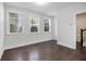 Well lit guest bedroom with 3 windows and hardwood floors at 2026 Manchester Ne St, Atlanta, GA 30324
