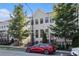 Charming townhouse showcasing a well-maintained exterior with a modern car parked in front at 2026 Manchester Ne St, Atlanta, GA 30324