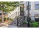 Inviting home entrance with brick stairs and black railing leading to the front door at 2026 Manchester Ne St, Atlanta, GA 30324