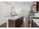 Modern kitchen with stainless steel appliances, large island with sink, and dark wood cabinets at 2026 Manchester Ne St, Atlanta, GA 30324