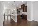 Gourmet kitchen featuring stainless steel appliances, dark cabinetry, and an eat-in island at 2026 Manchester Ne St, Atlanta, GA 30324