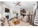 Inviting living room with a fireplace, hardwood floors, and an open view of the kitchen at 2026 Manchester Ne St, Atlanta, GA 30324