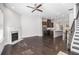 Open-concept living area with a fireplace, hardwood floors, and kitchen with a breakfast bar at 2026 Manchester Ne St, Atlanta, GA 30324