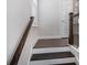 White staircase featuring wood treads and a complementary wood railing at 2026 Manchester Ne St, Atlanta, GA 30324