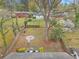 Expansive backyard with a fire pit area, mature trees, and a charming pergola at 2999 San Juan Dr, Decatur, GA 30032