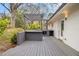 Outdoor kitchen on back porch with custom-built bar top and sink at 2999 San Juan Dr, Decatur, GA 30032