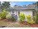 A cozy backyard with a pergola over an outdoor kitchen and ample space for entertaining and relaxing at 2999 San Juan Dr, Decatur, GA 30032