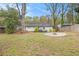 Spacious backyard with a fire pit area perfect for outdoor entertaining and relaxation at 2999 San Juan Dr, Decatur, GA 30032