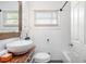 Bathroom featuring a unique vanity with bowl sink and white tile at 2999 San Juan Dr, Decatur, GA 30032