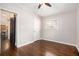 Bedroom with hardwood floors and sliding barn door leading to kitchen at 2999 San Juan Dr, Decatur, GA 30032