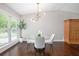 Bright dining area featuring a stylish chandelier, patterned wallpaper, and large windows for natural light at 2999 San Juan Dr, Decatur, GA 30032