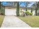 Charming single-story home features a white exterior, well-manicured lawn, and inviting curb appeal at 2999 San Juan Dr, Decatur, GA 30032