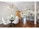 Open concept kitchen and dining area with stainless steel appliances, an island, and sleek countertops at 2999 San Juan Dr, Decatur, GA 30032