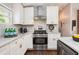Well-designed kitchen with stainless steel appliances, white cabinetry, and elegant countertops perfect for cooking and entertaining at 2999 San Juan Dr, Decatur, GA 30032
