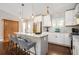 Bright, modern kitchen features stainless steel appliances, an island with seating, and sleek countertops at 2999 San Juan Dr, Decatur, GA 30032