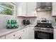 Bright kitchen with stainless steel appliances, white cabinetry, and stylish countertops for a fresh and modern feel at 2999 San Juan Dr, Decatur, GA 30032