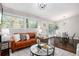 Open-concept living area featuring hardwood floors, modern decor, and ample natural light at 2999 San Juan Dr, Decatur, GA 30032
