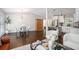 Open-concept living area featuring hardwood floors, modern decor, and opening to a dining area and kitchen at 2999 San Juan Dr, Decatur, GA 30032