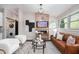 Cozy living room features a fireplace, television, and comfortable seating, with laundry in a closet at 2999 San Juan Dr, Decatur, GA 30032