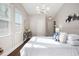 Bright main bedroom featuring large windows, hardwood floors, and elegant decor for a comfortable and stylish retreat at 2999 San Juan Dr, Decatur, GA 30032