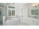 Marble tiled bathroom featuring a walk-in shower and soaking tub at 3776 N Stratford Ne Rd, Atlanta, GA 30342