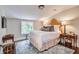 Cozy bedroom with natural light, hardwood floors, and stylish furnishings at 3776 N Stratford Ne Rd, Atlanta, GA 30342