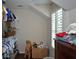 Organized closet with hanging clothes, baskets, and storage, bathed in natural light from the window at 3776 N Stratford Ne Rd, Atlanta, GA 30342