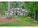 Charming home with manicured lawn, stone accents, and mature trees, offering curb appeal at 3776 N Stratford Ne Rd, Atlanta, GA 30342