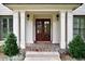 A charming front porch with stone flooring and a welcoming double-door entrance at 3776 N Stratford Ne Rd, Atlanta, GA 30342