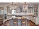 Bright kitchen with a central island, modern appliances, and decorative lighting fixtures at 3776 N Stratford Ne Rd, Atlanta, GA 30342