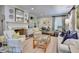 Bright living room featuring built-in shelving, a decorative fireplace, and comfortable seating at 3776 N Stratford Ne Rd, Atlanta, GA 30342