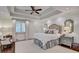 Bright main bedroom with trey ceiling, large windows, and neutral décor at 3776 N Stratford Ne Rd, Atlanta, GA 30342