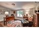 Home office featuring a wooden desk, leather chair, oriental rug and natural light at 3776 N Stratford Ne Rd, Atlanta, GA 30342