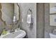 Elegant powder room featuring designer wallpaper and stylish fixtures at 3776 N Stratford Ne Rd, Atlanta, GA 30342
