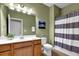 Bathroom with an undermount sink and tiled floors at 241 Orchards Cir, Woodstock, GA 30188