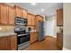 Well-equipped kitchen featuring stainless steel appliances, granite countertops, and ample cabinet space at 241 Orchards Cir, Woodstock, GA 30188