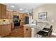 Stylish kitchen featuring granite countertops, stainless steel appliances, and a breakfast bar at 241 Orchards Cir, Woodstock, GA 30188