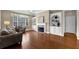Comfortable living room with a fireplace and a view into the kitchen at 241 Orchards Cir, Woodstock, GA 30188