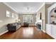 Cozy living room with a fireplace and built-in shelving for storage at 241 Orchards Cir, Woodstock, GA 30188