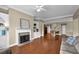 Open-concept living area with fireplace, built-ins, and seamless flow to the kitchen at 241 Orchards Cir, Woodstock, GA 30188