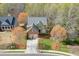 Beautiful two-story home with landscaped front yard and mature trees in a desirable neighborhood at 3743 Southland Dr, Buford, GA 30519