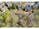A house, surrounded by lush trees, in a wooded neighborhood at 3743 Southland Dr, Buford, GA 30519