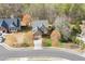 Beautiful two-story home with landscaped front yard and mature trees in a desirable neighborhood at 3743 Southland Dr, Buford, GA 30519