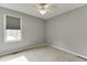 Inviting bedroom with neutral carpet and a window offering natural light at 3743 Southland Dr, Buford, GA 30519
