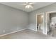A carpeted bedroom shows doorways to the bathroom and hallway at 3743 Southland Dr, Buford, GA 30519