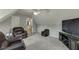 Spacious bonus room with vaulted ceiling, a TV, and three chairs at 3743 Southland Dr, Buford, GA 30519